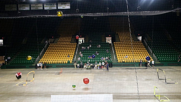 Robotic blimps maneuver over the pitch during 12 hours of match play at the 2nd annual Airborne Robotics Cup at EagleBank Arena